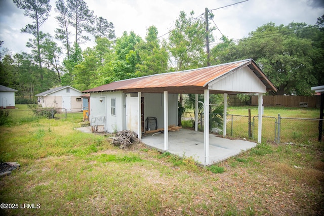 exterior space featuring a gate and a fenced backyard