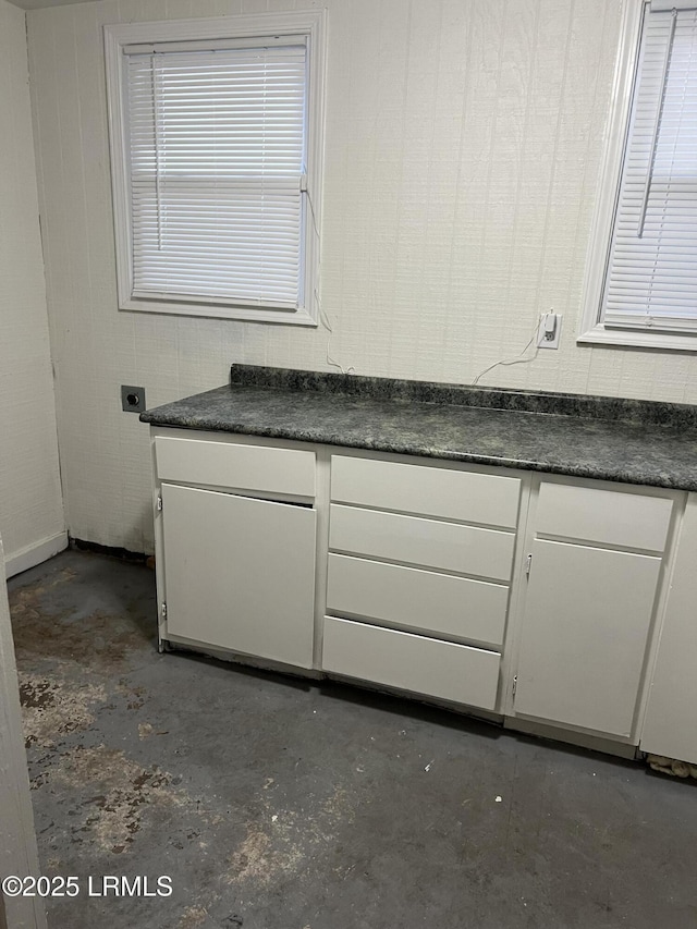 bathroom with concrete flooring