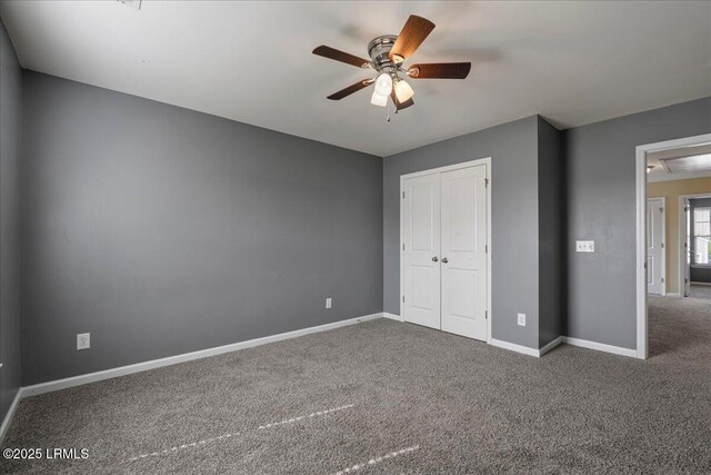 28 Kings Cross Ct, Beaufort, SC 29902 - unfurnished bedroom featuring a closet, carpet flooring, baseboards, and a ceiling fan
