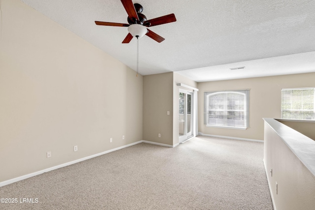 897 Fording Island Rd Unit 301, Bluffton, SC 29910 - unfurnished room with a ceiling fan, light colored carpet, baseboards, and a textured ceiling