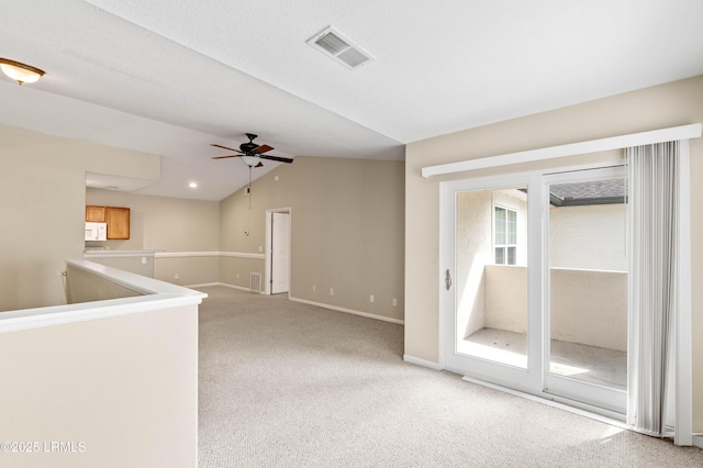 897 Fording Island Rd Unit 301, Bluffton, SC 29910 - unfurnished room featuring light carpet, ceiling fan, baseboards, and lofted ceiling