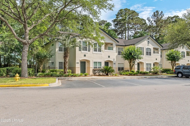 897 Fording Island Rd Unit 301, Bluffton, SC 29910 - view of front of property featuring stucco siding and uncovered parking