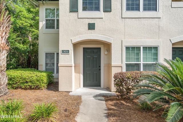 897 Fording Island Rd Unit 301, Bluffton, SC 29910 - view of exterior entry with stucco siding