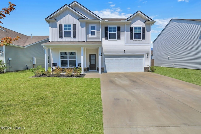 view of front of property with a porch, a garage, and a front lawn