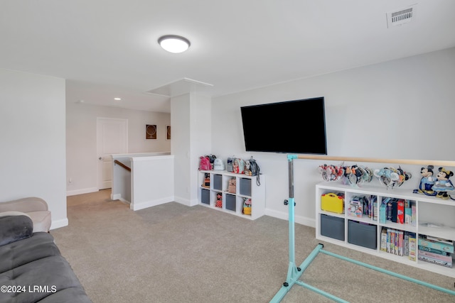 game room featuring light colored carpet