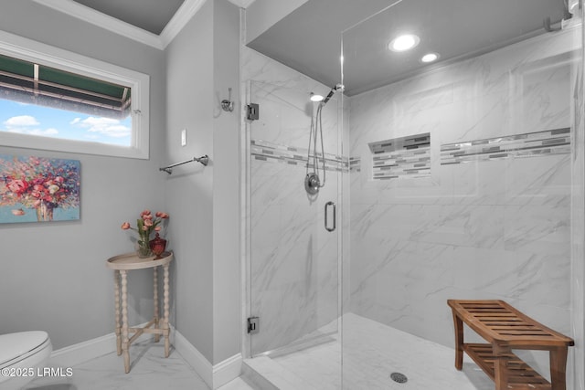 bathroom with ornamental molding, a shower with door, and toilet