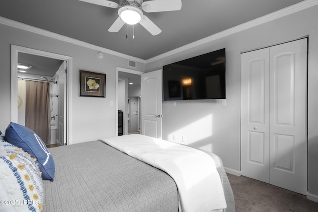 bedroom with crown molding, ensuite bath, a closet, ceiling fan, and carpet