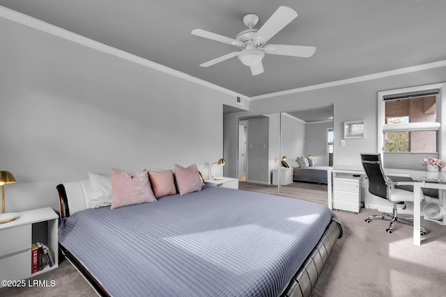 carpeted bedroom featuring crown molding and ceiling fan