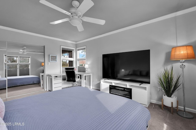 bedroom with ornamental molding, carpet, and ceiling fan