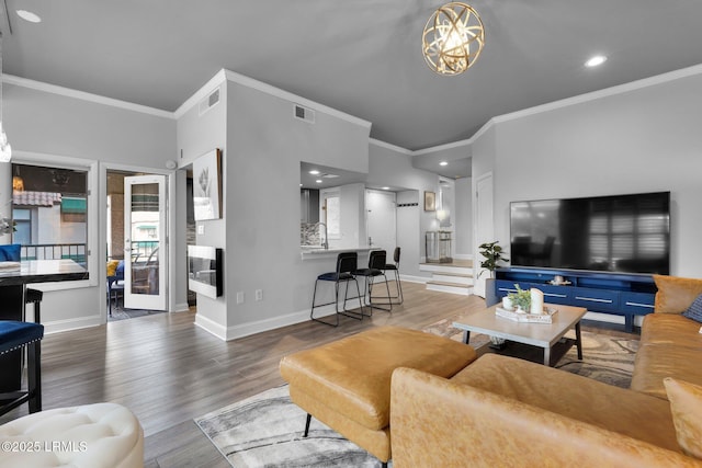 living room featuring dark hardwood / wood-style flooring and ornamental molding