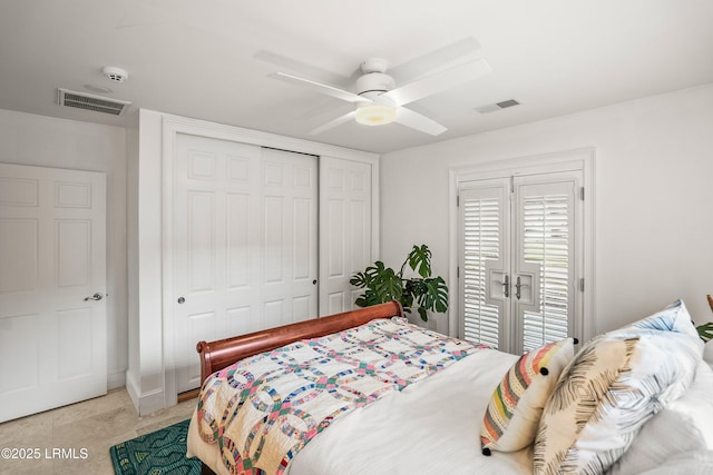 bedroom featuring ceiling fan, visible vents, a closet, and light tile patterned flooring