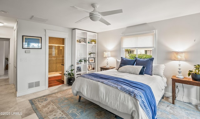 bedroom featuring visible vents, ensuite bathroom, light tile patterned flooring, ceiling fan, and baseboards