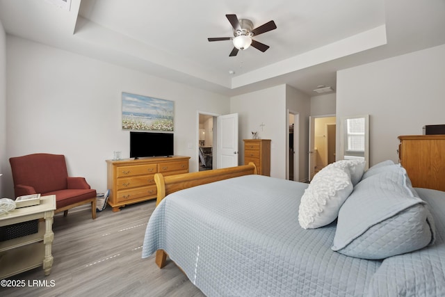 120 Sifted Grain Rd, Bluffton, SC 29909 - bedroom featuring a tray ceiling, light wood finished floors, and ceiling fan