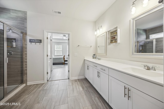 120 Sifted Grain Rd, Bluffton, SC 29909 - ensuite bathroom featuring double vanity, a shower stall, baseboards, and ceiling fan