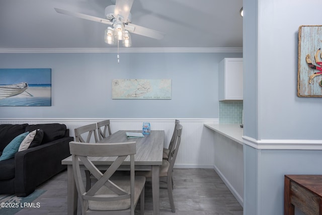 663 William Hilton Pkwy Unit 2126, Hilton Head Island, SC 29928 - dining room featuring ceiling fan, ornamental molding, wainscoting, and wood finished floors