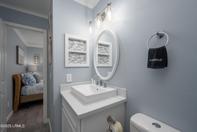 663 William Hilton Pkwy Unit 2126, Hilton Head Island, SC 29928 - ensuite bathroom featuring crown molding, vanity, and wood finished floors
