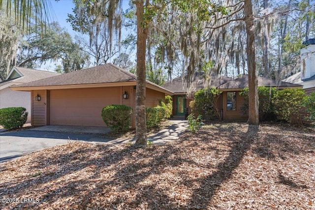 408 Bb Sams Dr, Saint Helena Island, SC 29920 - ranch-style home with a garage, driveway, and roof with shingles