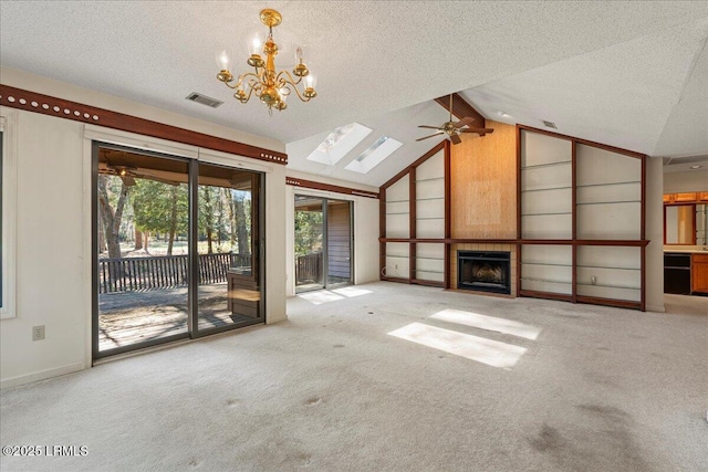 unfurnished living room featuring lofted ceiling, carpet floors, a textured ceiling, and a tiled fireplace