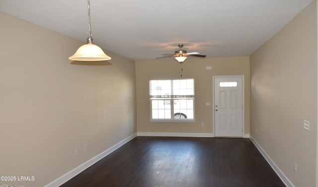 entryway with ceiling fan and dark hardwood / wood-style flooring