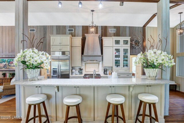 34 W Beach Lagoon Dr, Hilton Head Island, SC 29928 - kitchen with visible vents, built in refrigerator, and custom range hood