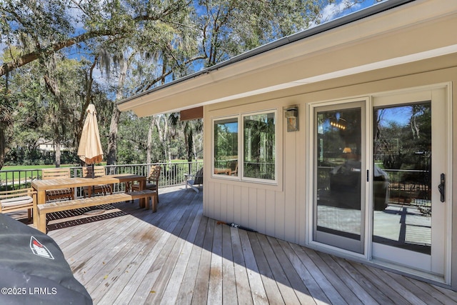 34 W Beach Lagoon Dr, Hilton Head Island, SC 29928 - wooden terrace with outdoor dining space