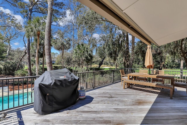 34 W Beach Lagoon Dr, Hilton Head Island, SC 29928 - wooden terrace with a fenced in pool and grilling area
