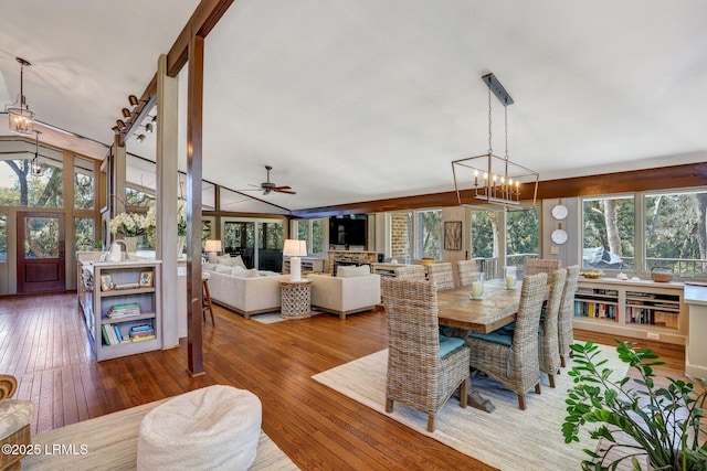 34 W Beach Lagoon Dr, Hilton Head Island, SC 29928 - dining space with ceiling fan with notable chandelier and hardwood / wood-style flooring