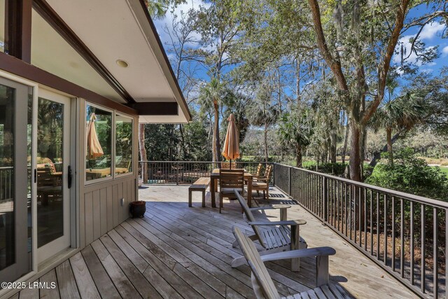 34 W Beach Lagoon Dr, Hilton Head Island, SC 29928 - wooden terrace featuring outdoor dining space
