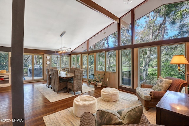 34 W Beach Lagoon Dr, Hilton Head Island, SC 29928 - sunroom with a notable chandelier and vaulted ceiling with beams