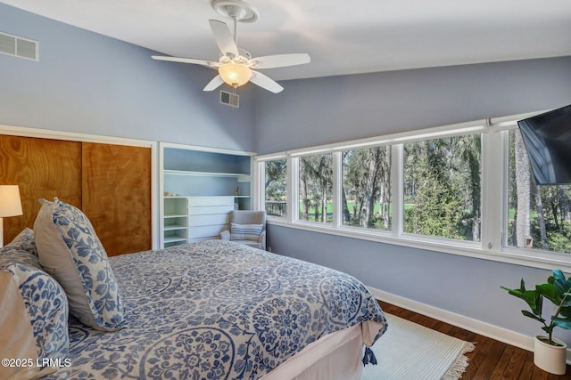 34 W Beach Lagoon Dr, Hilton Head Island, SC 29928 - bedroom featuring wood finished floors, baseboards, visible vents, and lofted ceiling