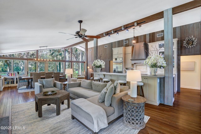 34 W Beach Lagoon Dr, Hilton Head Island, SC 29928 - living area with visible vents, lofted ceiling with beams, dark wood finished floors, rail lighting, and ceiling fan