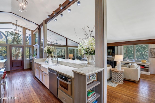 34 W Beach Lagoon Dr, Hilton Head Island, SC 29928 - kitchen with dark wood-style flooring, open floor plan, appliances with stainless steel finishes, and a sink