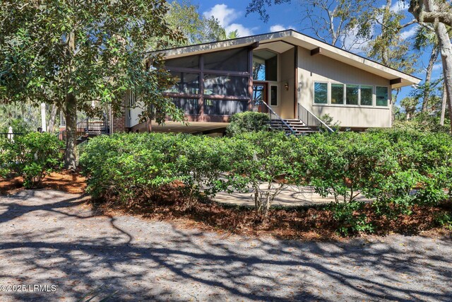 34 W Beach Lagoon Dr, Hilton Head Island, SC 29928 - view of front of home with a sunroom