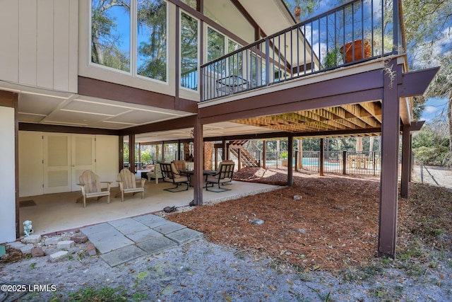34 W Beach Lagoon Dr, Hilton Head Island, SC 29928 - view of patio / terrace with a fenced in pool, stairs, and fence