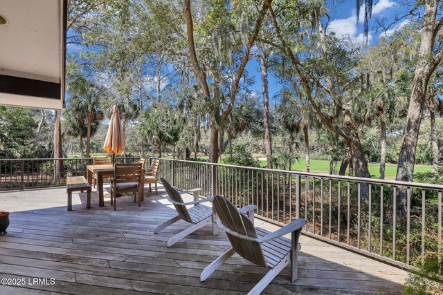 34 W Beach Lagoon Dr, Hilton Head Island, SC 29928 - wooden terrace featuring outdoor dining space