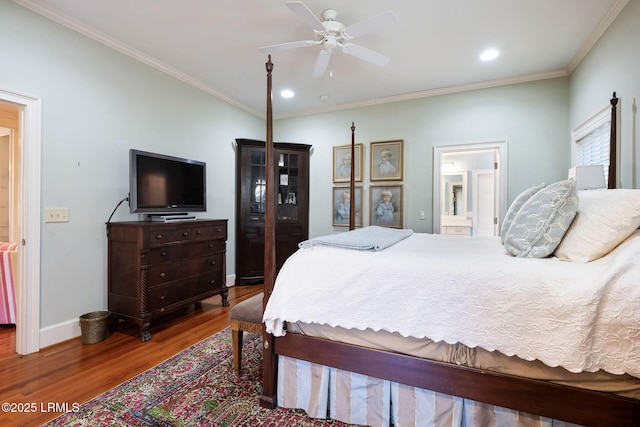 bedroom featuring crown molding, ceiling fan, connected bathroom, and hardwood / wood-style floors