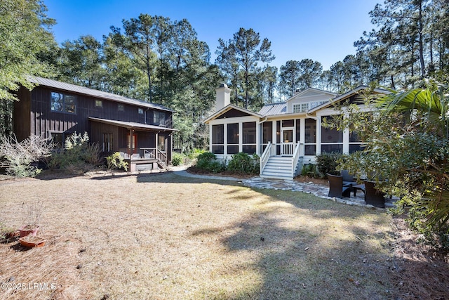 view of front of home with a sunroom