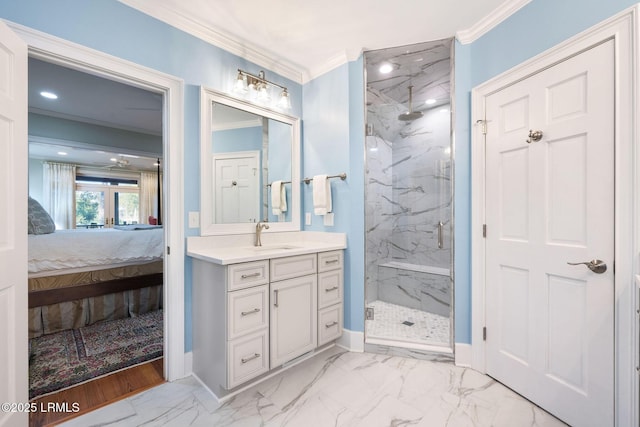 bathroom featuring an enclosed shower, vanity, and ornamental molding