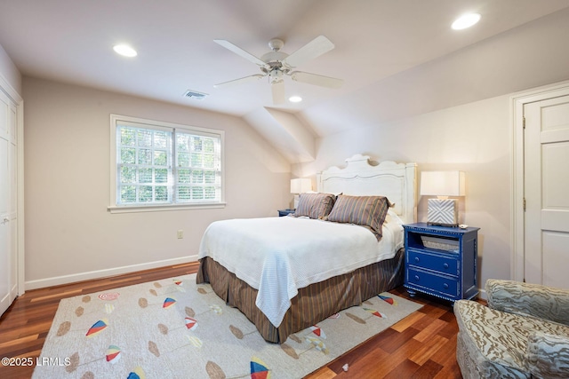 bedroom with lofted ceiling, dark hardwood / wood-style floors, and ceiling fan