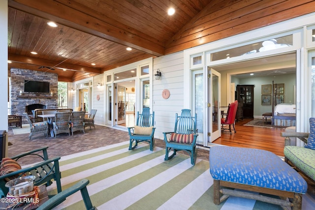 view of patio with a stone fireplace