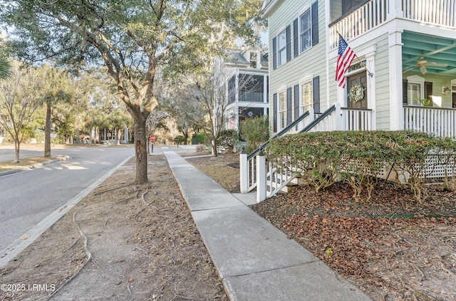 view of side of property featuring a balcony