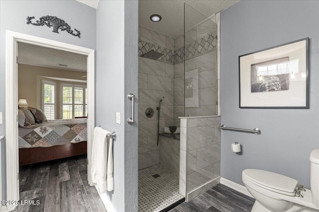 101 Redtail Dr, Bluffton, SC 29909 - ensuite bathroom with wood finished floors, walk in shower, and a textured ceiling