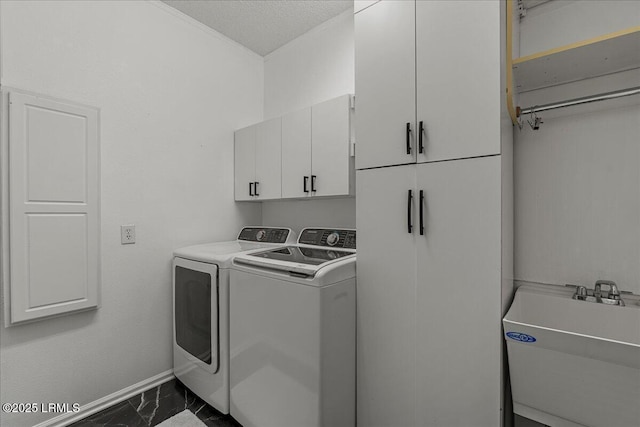 101 Redtail Dr, Bluffton, SC 29909 - laundry room with dark marble finish floors, cabinet space, washing machine and clothes dryer, and ornamental molding