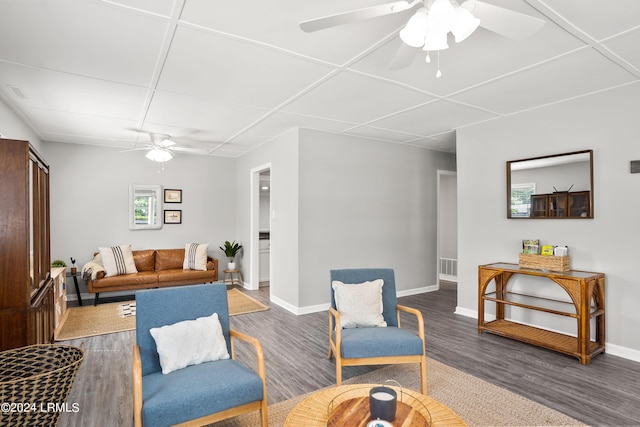 living room featuring ceiling fan, a healthy amount of sunlight, and dark hardwood / wood-style floors