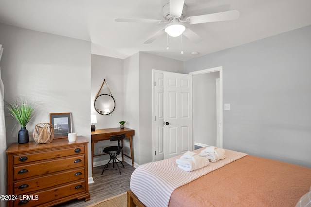 bedroom with hardwood / wood-style flooring and ceiling fan