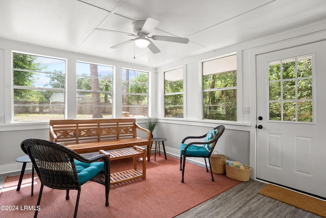 sunroom featuring ceiling fan