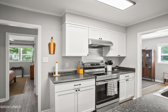 kitchen featuring electric stove, white cabinetry, ornamental molding, and hardwood / wood-style floors