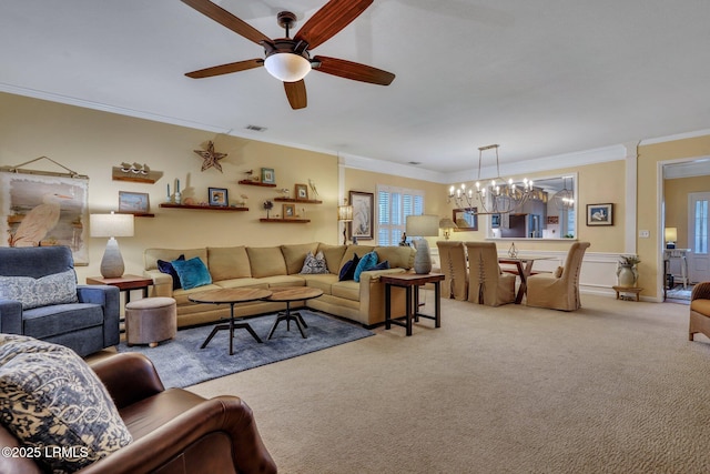 living area featuring light colored carpet, crown molding, visible vents, and ceiling fan with notable chandelier