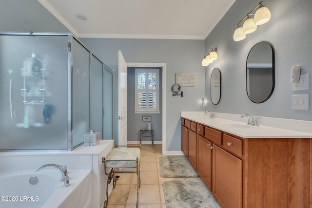 full bathroom with tile patterned flooring, a sink, ornamental molding, a bath, and a stall shower