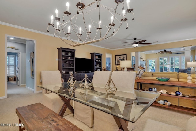 carpeted dining area with a healthy amount of sunlight, baseboards, and crown molding